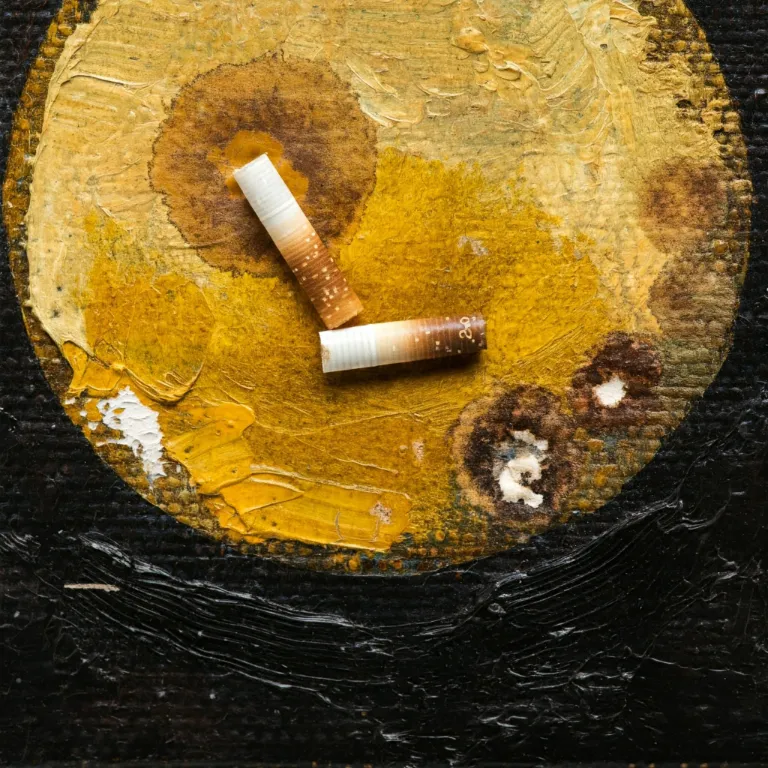 Nicotine stains not only discolor the varnish but can also penetrate the oil paint layers